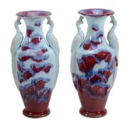 A pair of Chinese flambe glazed vases with handles shaped as phoenixes, 37  A pair of Chinese flambe