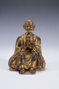 A Tibetan gilded figure of a monk, 18th century  A Tibetan gilded figure of a monk, 18th