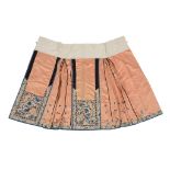 A coral ground pleated skirt for a Han woman, circa 1900  A coral ground pleated skirt for a Han