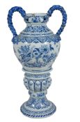 A large Dutch Delft blue and white urn and separate stand, late 19th century  A large Dutch Delft