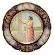 A Vienna-style plate, decorated with a classical maiden picking blossom  A Vienna-style plate,