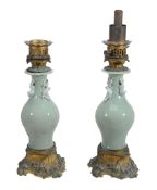 A pair of Chinese celadon porcelain gilt-metal mounted lamp bases  A pair of Chinese celadon