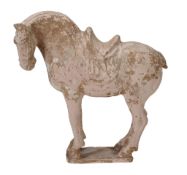 A Tang-style pottery model of a horse , modelled standing on a rectangular base  A Tang-style