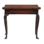 A George II mahogany folding tea table, circa 1740  A George II mahogany folding tea table,