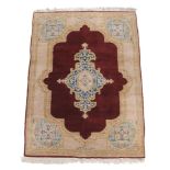 A Kirman rug, approximately 190 x 126cm  A Kirman rug,   approximately  190 x 126cm