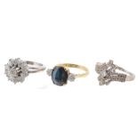 A sapphire and diamond three stone ring , the oval cut sapphire in a four...  A sapphire and diamond