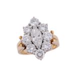 A diamond cluster ring, the central marquise shaped diamond within a...  A diamond cluster ring,