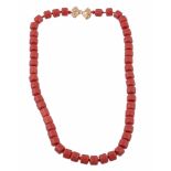 A red bead necklace , the uniform dyed red beads to a polished bow shaped clasp  A red bead necklace