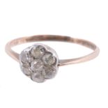 A diamond cluster ring, the central old cut diamond within a surround of...  A diamond cluster ring,