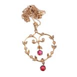 A red paste and seed pearl necklace, the openwork heart shaped pendant with...  A red paste and seed