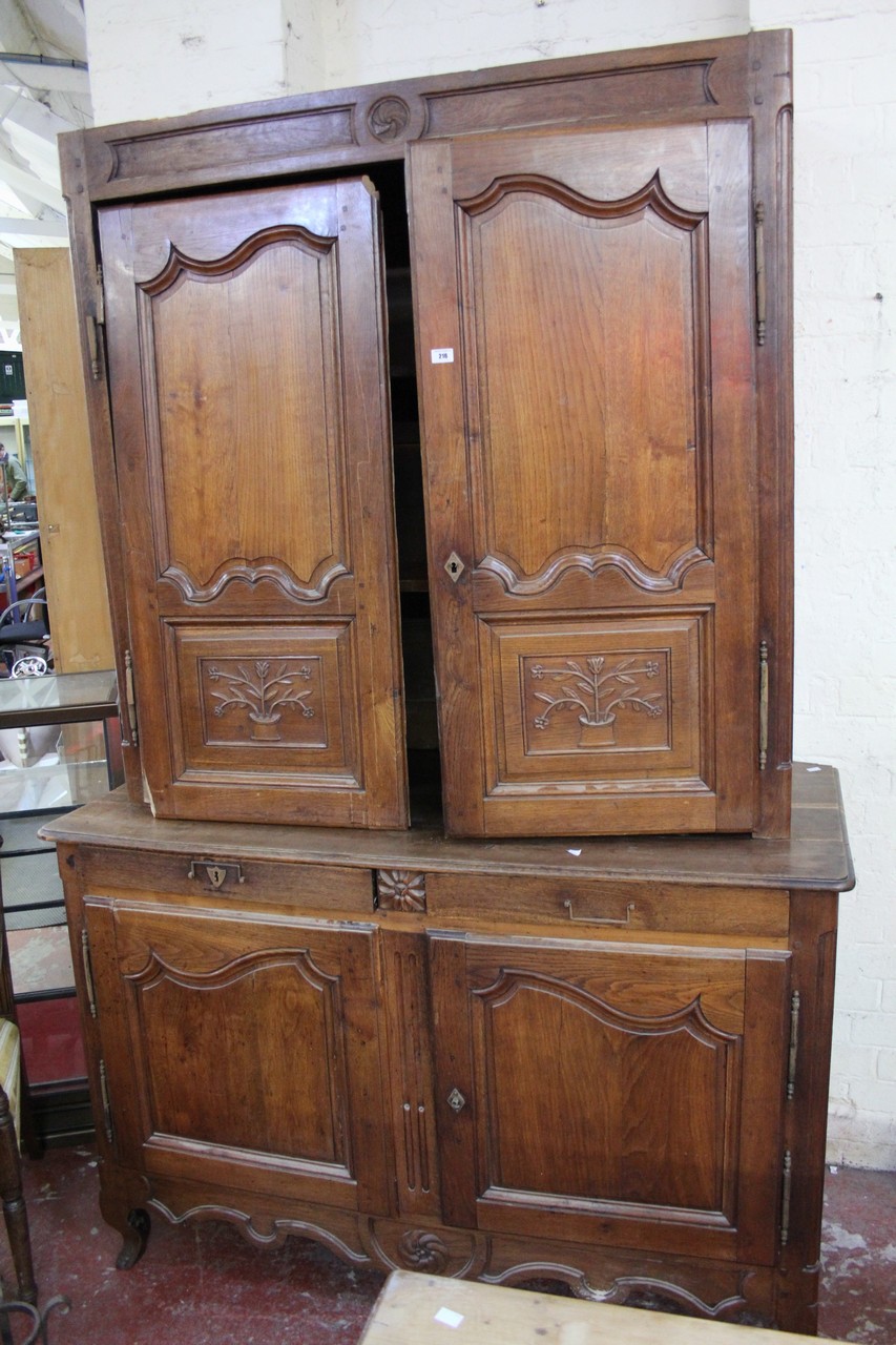 A 19th century French oak two piece cupboard with shaped panelled doors. 230cm h x 150cm w.