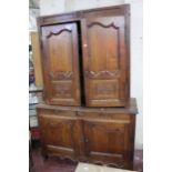 A 19th century French oak two piece cupboard with shaped panelled doors. 230cm h x 150cm w.