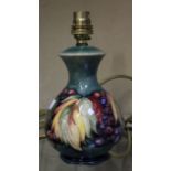 A Moorcroft leaf and grape pattern table lamp, green ground, baluster shaped, stamp to base, 22cm