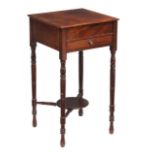 An early 19th Century mahogany table with a frieze drawer on ring turned tapering legs, the