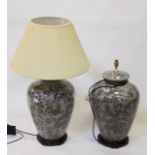 A pair of modern Oriental ceramic table lamps, grey ground with black foliate decoration, on