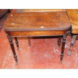 A 19th century mahogany foldover tea table.