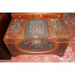 A Chinese carved and stained hardwood coffer, circa 1930, the top and front carved with figural