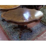 A Victorian walnut and burr walnut centre table, the crossbanded cartouche shaped top above a turned