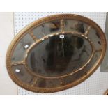 An oval 19th Century gilt framed mirror, Regency style gold framed mirror and a study of a nude