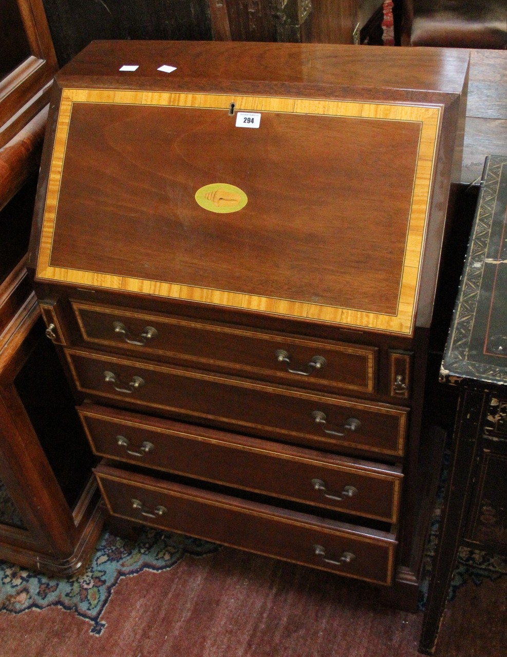 A mahogany and satin wood banded Georgian style bureau.