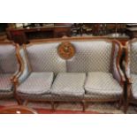 Four Louis XVI style armchairs and a matching sofa.