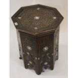 A Middle Eastern octagonal table intricately carved with bone inlay 50cm high, 45cm diameter