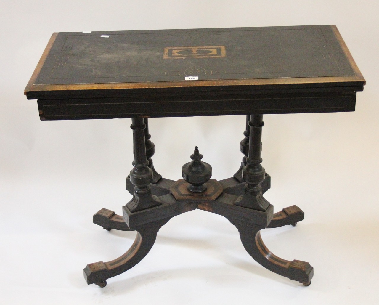 A late 19th century aesthetic design card table.