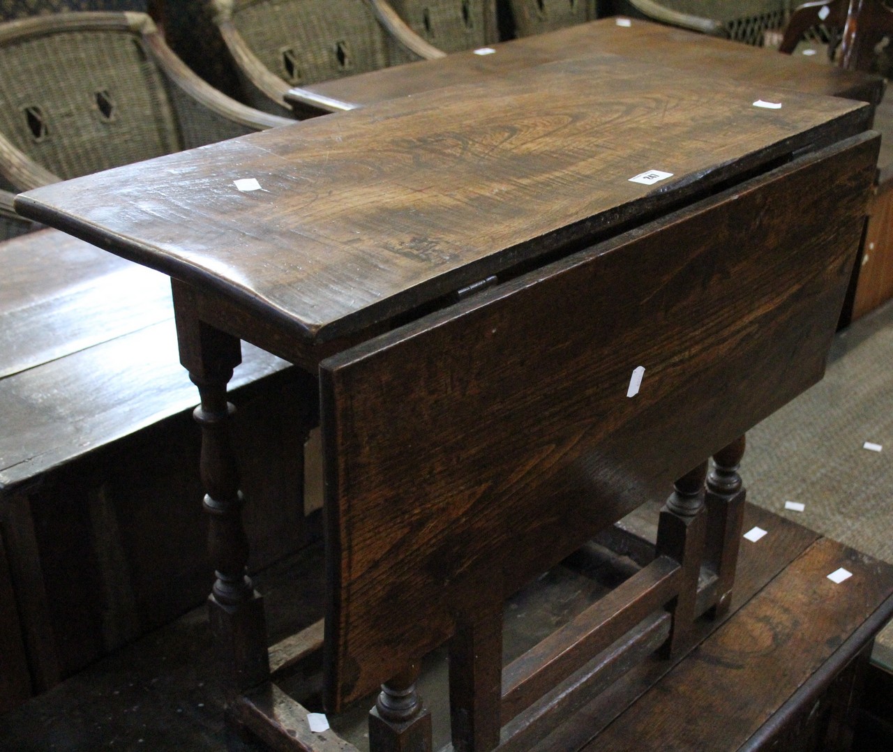 An elm single drop leaf table 69cm wide