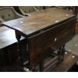 An elm single drop leaf table 69cm wide