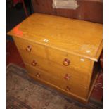 A Victorian pine chest with painted wood grain finish,two short drawers over two long.