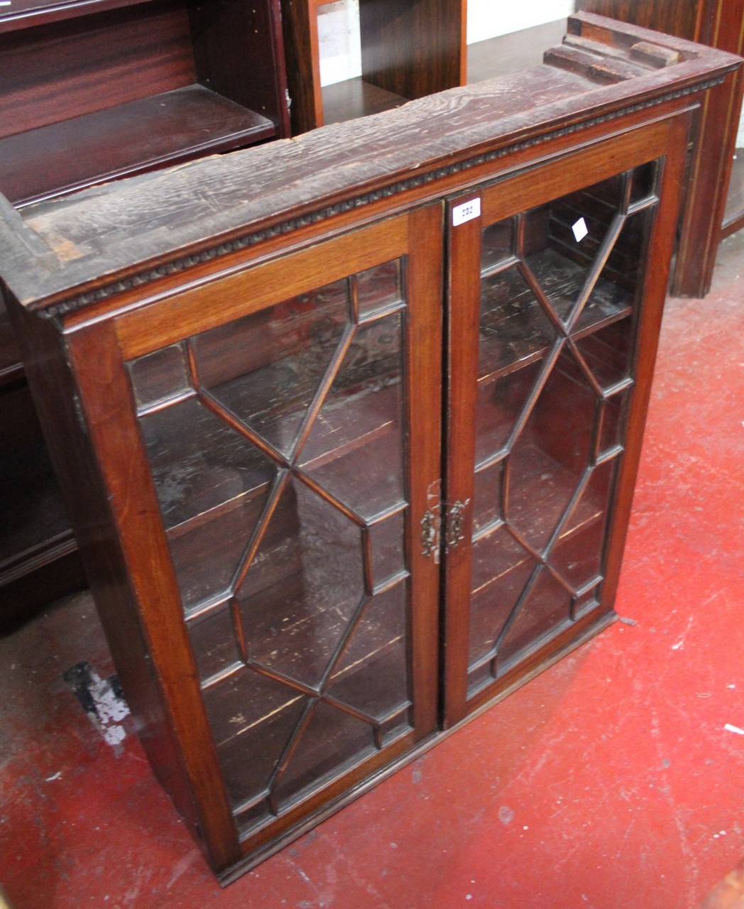 A George III style mahogany cabinet with astragal glazed doors 99cm high, 85cm wide Best Bid