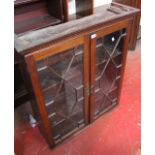 A George III style mahogany cabinet with astragal glazed doors 99cm high, 85cm wide Best Bid