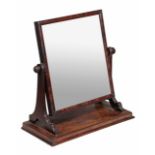 A George III mahogany dressing mirror, circa 1800, the rectangular mirror on twin supports above