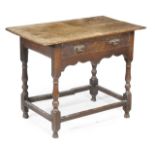 A George III oak side table, circa 1760, the rectangular top above a frieze drawer, turned and