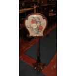 A William IV rosewood and needlework pole screen