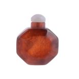 A Chinese amber snuff bottle bearing octagonal shape, 19th century  A Chinese amber snuff bottle