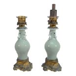 A pair of Chinese celadon porcelain gilt-metal mounted lamp bases  A pair of Chinese celadon