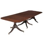 A mahogany triple pedestal dining table in the Regency style  A mahogany triple pedestal dining