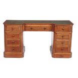 A mahogany inverted breakfront pedestal desk, circa 1900  A mahogany inverted breakfront pedestal