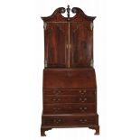 A George II oak bureau bookcase, circa 1750, possibly Anglo-Dutch  A George II oak bureau bookcase,