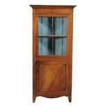 A Regency mahogany and inlaid corner cupboard, circa 1820  A Regency mahogany and inlaid corner