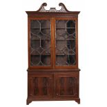 A mahogany cabinet bookcase , in George III style  A mahogany cabinet bookcase  , in George III