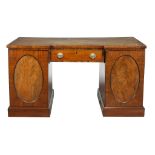 A mahogany desk, circa 1800 and later, the tooled simulated leather inset...  A mahogany desk, circa