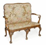 A walnut sofa, in George I style, 19th century A walnut sofa, in George I style, 19th century, the