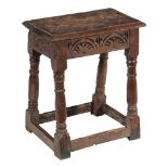 An oak joint stool, circa 1660 and later, the rectangular seat above a...  An oak joint stool,