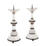 A pair of Continental rock crystal and metal mounted pricket candlesticks in...  A pair of