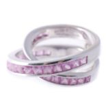 A pink sapphire ring, the shank of twisted form set with square shaped pink... A pink sapphire ring,