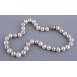 A pink and white freshwater cultured pearl necklace A pink and white freshwater cultured pearl
