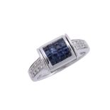 A reversible sapphire and diamond ring, the central swivelling panel set... A reversible sapphire