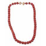 A red bead necklace , the uniform dyed red beads to a polished bow shaped clasp A red bead
